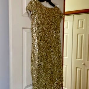 Cocktail dress, gold, was a 20 or 22but had it tailored to 18 or 18w.
